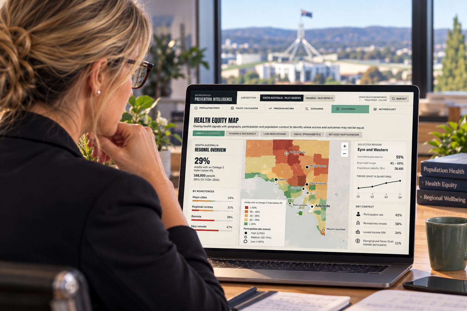 Rachel reviewing a health equity map on a laptop